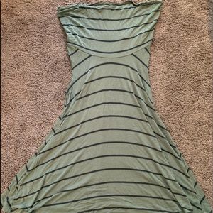 Green with black striped turtleneck tunic.